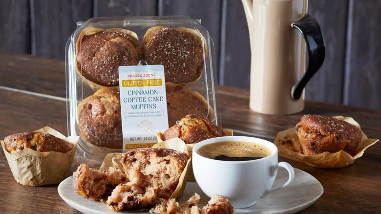 Box of trader joe's muffins on table with coffee