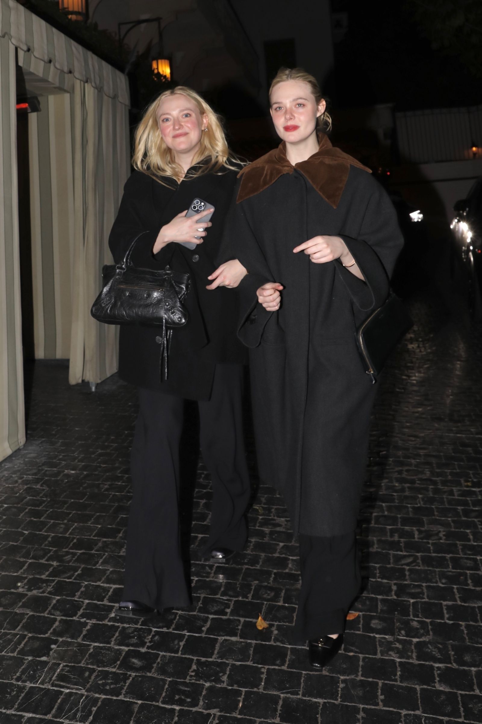 Image may contain Elle Fanning Dakota Fanning Clothing Coat Fashion Accessories Bag Handbag Adult Person and Face