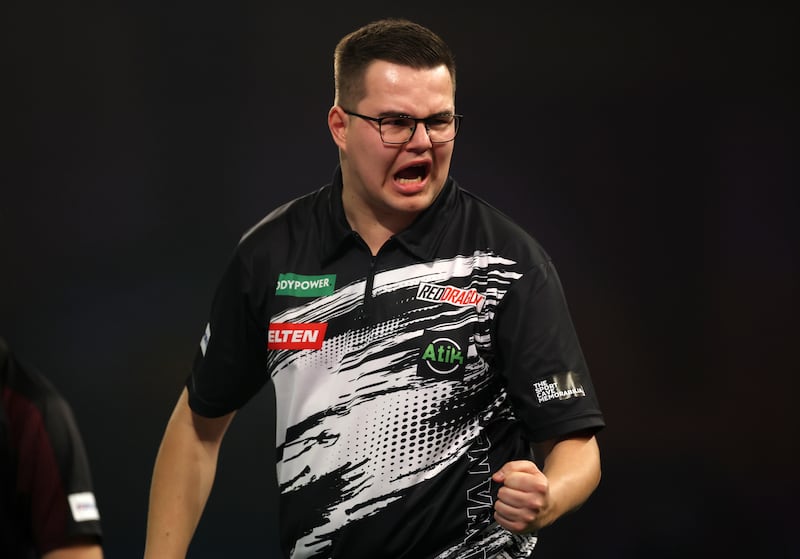 Gian van Veen of Netherlands celebrates his victory against Luke Humphries of England. Photograph: Warren Little/Getty