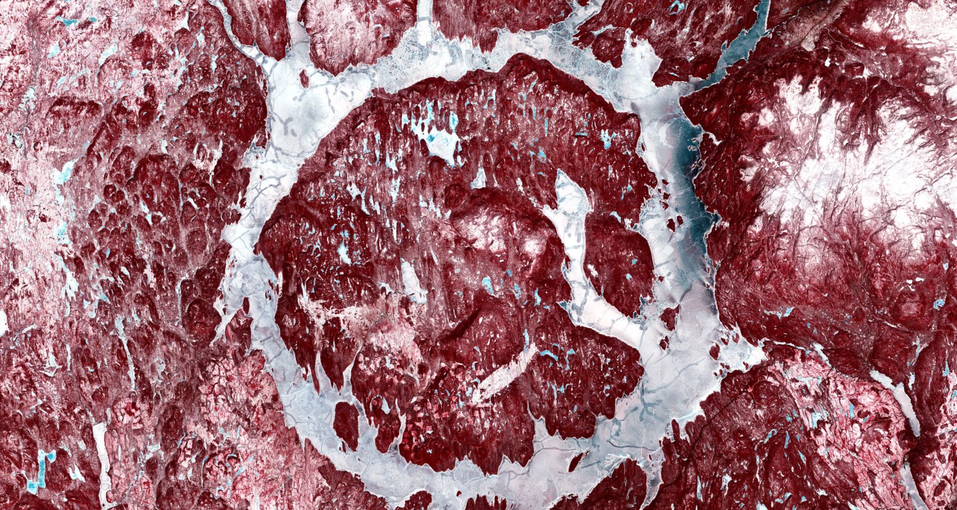 A snowy landscape shows red rocks with white snow interspersed to create a muscle-y, meaty image