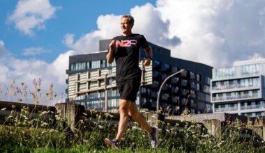 Man runs outside in long grass