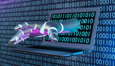 Cyborg's hand coming from laptop screen with a digital binary code theme background.