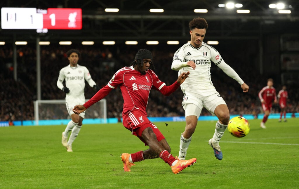 Jeremie Frimpong crosses for Cody Gakpo to score during Liverpool's Premier League match against Fulham at Craven Cottage.