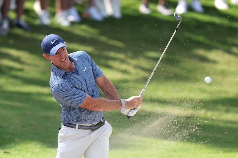 Rory McIlroy plays a shot from a bunker on the seventh hole. Photograph: Andrew Redington/Getty Images