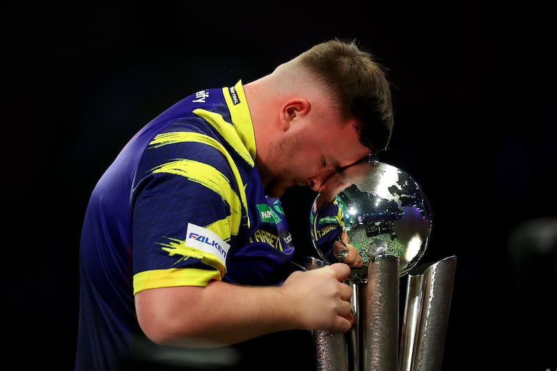 Luke Littler with the Sid Waddell trophy after his World Darts Championship final win. Photograph: Warren Little/Getty Images