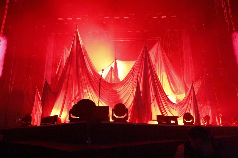 'Frontman Simon Neil opens Biffy Clyro’s set from behind ghostly white sheets'.  Photograph Nick Bradshaw
