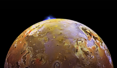 a glowing volcanic eruption on the surface of Io, a moon of Jupiter, as seen from space, with the eruption positioned on Io