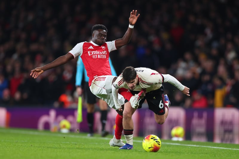 Bukayo Saka of Arsenal fouls Milos Kerkez of Liverpool during their Premier League match on Thursday night. Photograph: Marc Atkins/Getty Images