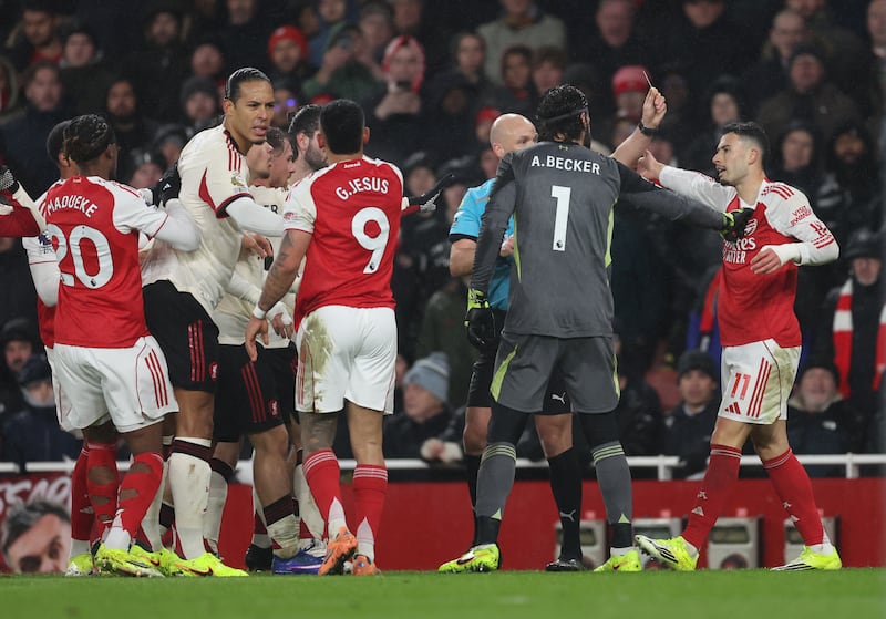 Gabriel Martinelli of Arsenal receives a yellow card for his reaction to Conor Bradley's injury - he is lucky he didn't try that during a Tyrone intermediate championship game. Photograph: Catherine Ivill - AMA/Getty Images