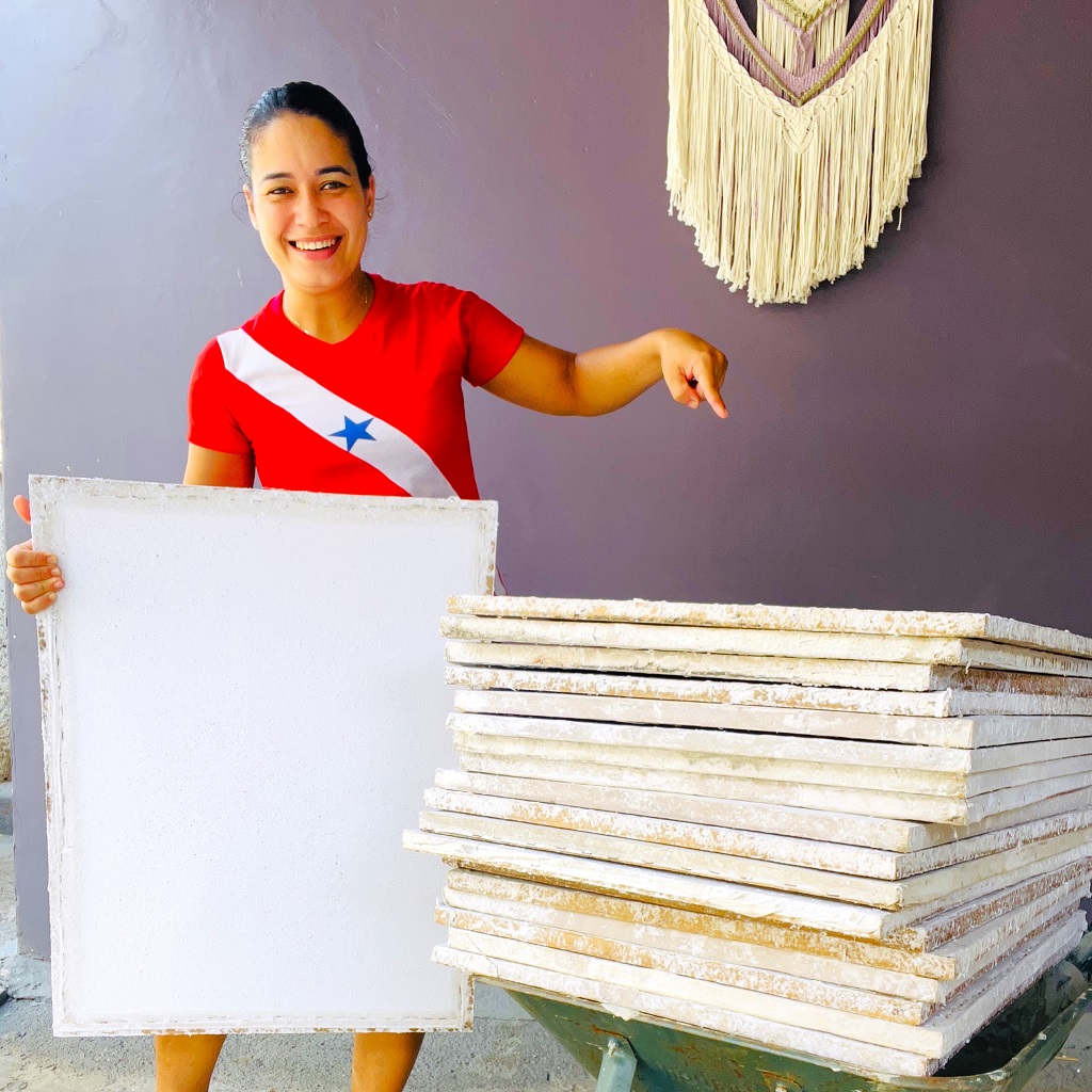 Alessandra Moreira shows sheets of plantable seed paper produced at her home in Altamira, the most deforested municipality in the Brazilian Amazon.