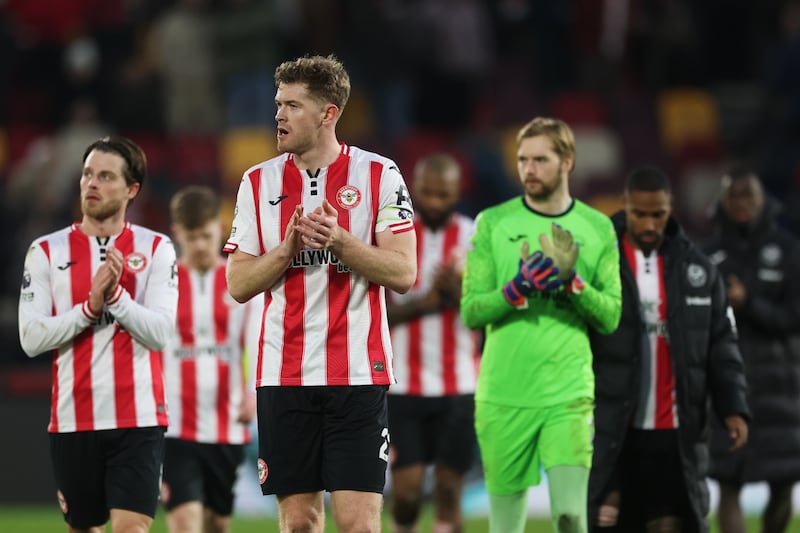Nathan Collins (centre) and Caoimhín Kelleher after Brentford's defeat to Nottingham Forest on Sunday. Photograph: Richard Pelham/Getty Images