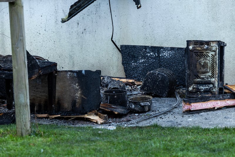 Charred items outside the house fire at Creston Avenue, Finglas, Dublin on Thursday. Photograph: Conor Ó Mearáin/Collins Photo Agency