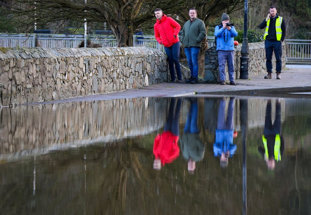 People look at flood water covering a road, after the River Slaney burst its banks during Storm Chandra, in Enniscorthy, near Wexford, south east Ireland on January 28, 2026. Photograph: Getty Images