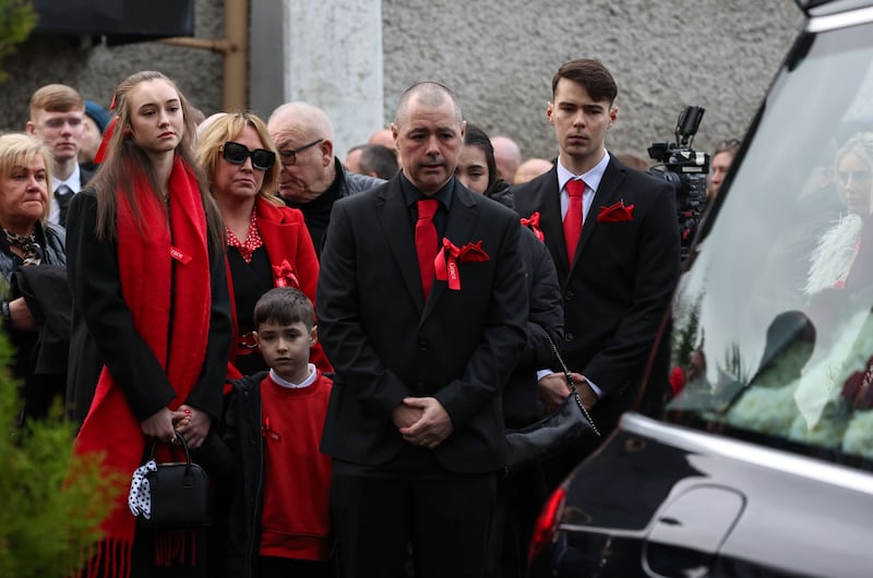 Grace's family, including her father, Martin and mother Siobhán, stand behind the hearse after the funeral Mass. Photograph: Colin Keegan/Collins