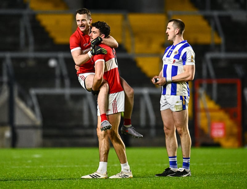 Tom O'Sullivan is held aloft by his Dingle team-mate Mark O'Connor after their side's victory as Céin D'Arcy of Ballyboden St Enda's looks on after the AIB GAA Football All-Ireland Senior Club Championship semi-final match between Dingle of Kerry and Ballyboden St Enda's of Dublin at SuperValu Páirc Uí Chaoimh in Cork. PICTURE: Piaras Ó Mídheach/Sportsfile