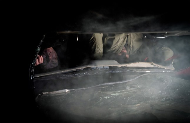 Aaron and John upside down in a car in Corriedale