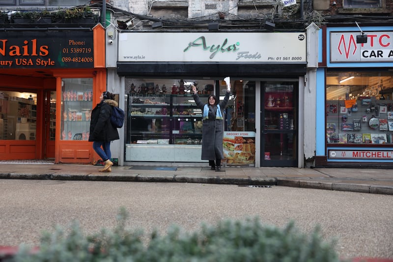 Niamh Browne celebrates her cheap food purchase at Ayla Foods on Dublin's Capel Street. Photograph: Enda O'Dowd