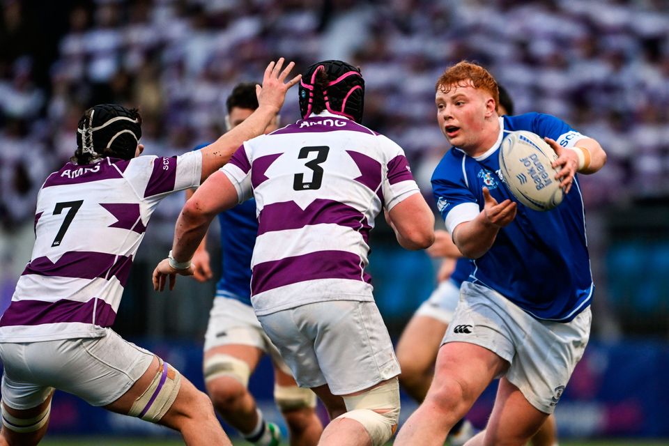 Joseph Christle of St Mary’s College in action against Charlie Hussey, left, and Alex Evans of Clongowes Wood College at Energia Park in Dublin. Photo by Daire Brennan/Sportsfile