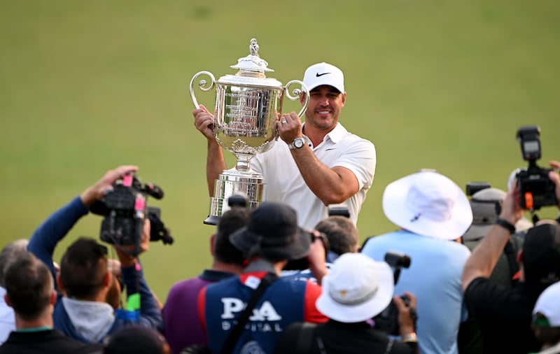 Brooks Koepka holds The Wanamaker Trophy after the final round of the PGA Championship at Oak Hill Country Club in May 2023. Photograph: Ross Kinnaird/Getty