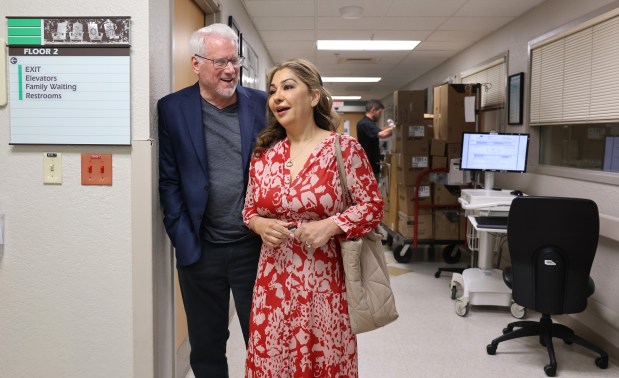 Tim Williams and his wife, Sara Williams, visit Delray Medical Center in Delray Beach, Friday, Jan. 2, 2026. Williams, the director of the hospital's proton therapy center, became a patient there after collapsing at home. He survived a stroke, nine days in a coma, an in-bed surgery and a long recovery. (Carline Jean/South Florida Sun Sentinel)