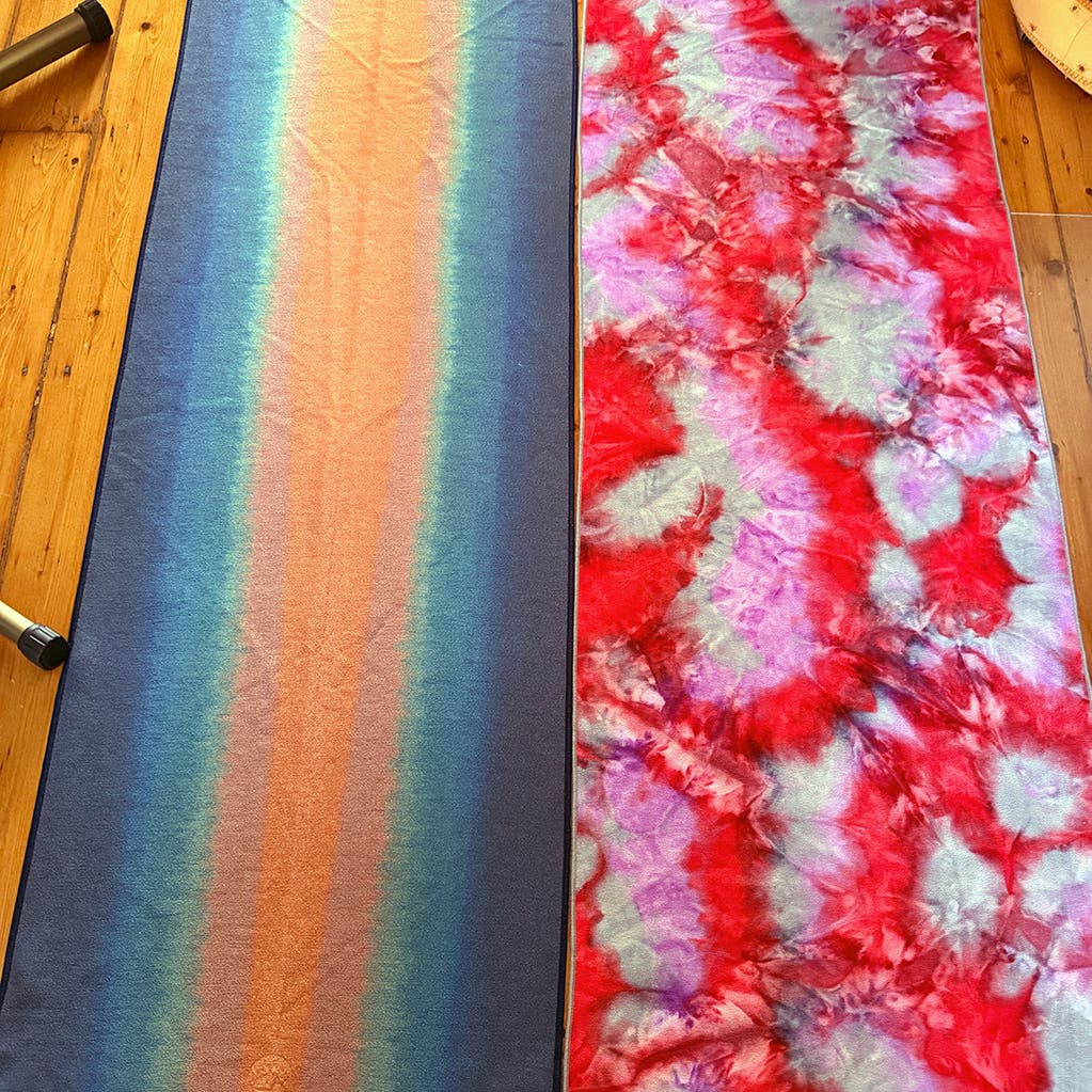 Two yoga mats on side by side and on display.