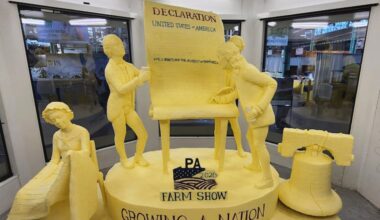 Agriculture Secretary Russell Redding unveiled the 2026 Pennsylvania Farm Show Butter Sculpture, a 1,000-pound sculpture that illustrates how defining moments in U.S. history and the evolution of agriculture have grown side by side to shape our nation. This year’s sculpture is titled, "A Toast to Our Nation’s 250th Anniversary: Inspired by Founders. Grown by Farmers." The Pennsylvania Department of Agriculture, American Dairy Association North East, and the Pennsylvania Dairy Promotion Program sponsored the sculpture. “The butter sculpture is a people-pleasing favorite every year at the Pennsylvania Farm Show,” Secretary Redding said.Created for America’s 250th anniversary, this year’s butter sculpture honors Pennsylvania’s pivotal role in the nation’s founding and the growth of American agriculture and our nation’s economy. Set in 1776 Philadelphia, the sculpture depicts Benjamin Franklin and the Founding Fathers at the signing of the Declaration of Independence, complete with a celebratory toast with milk. Patriotic elements, including the Liberty Bell, a tribute to Betsy Ross, and red, white, and blue accents underscore the spirit of the semi-quincentennial. At the same time, the base highlights Pennsylvania’s enduring agricultural heritage.