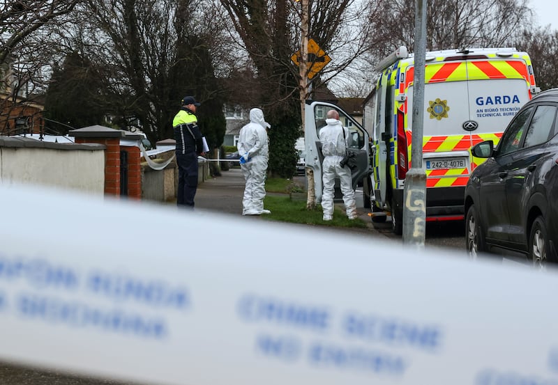 Gardaí at the house in Clondalkin where the body of 11-year-old Oisín O'Reilly was found. Photograph: Colin Keegan/Collins