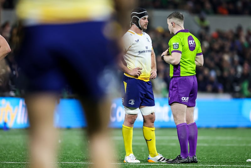 Referee Eoghan Cross speaks to Leinster's Caelan Doris. Photograph: Nick Elliott/Inpho