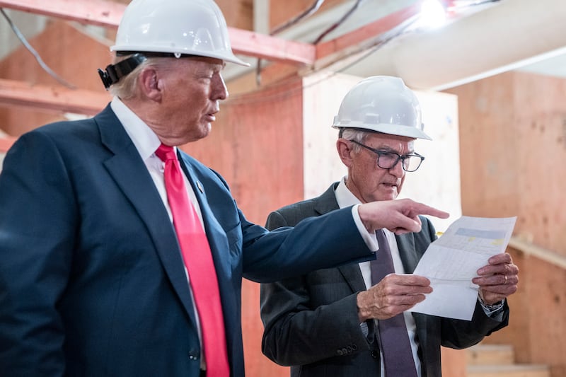 US president Donald Trump presents a document to Jerome Powell while touring a construction project at the Federal Reserve. Photograph: Haiyun Jiang/New York Times