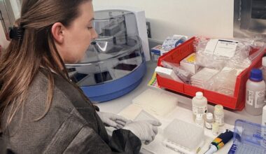 Public Health lab epidemiologist works on wastewater testing samples