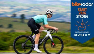 Woman on Colnago with Rouvy banner