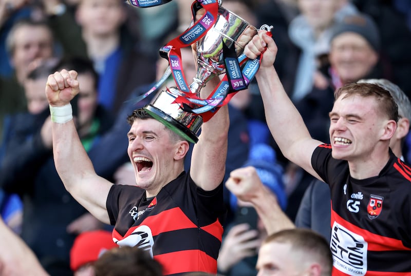 Ballygunner's Peter Hogan and Michael Mahony lift the Tommy Moore Cup. Photograph: Dan Clohessy/Inpho
