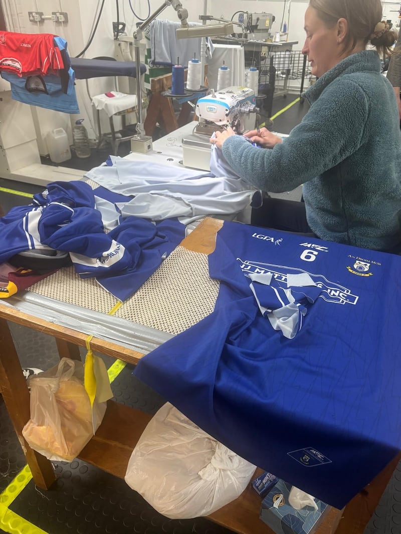 Lisa Leathem making a GAA jersey for the Derry-based sportswear company, MFC Sportsgear