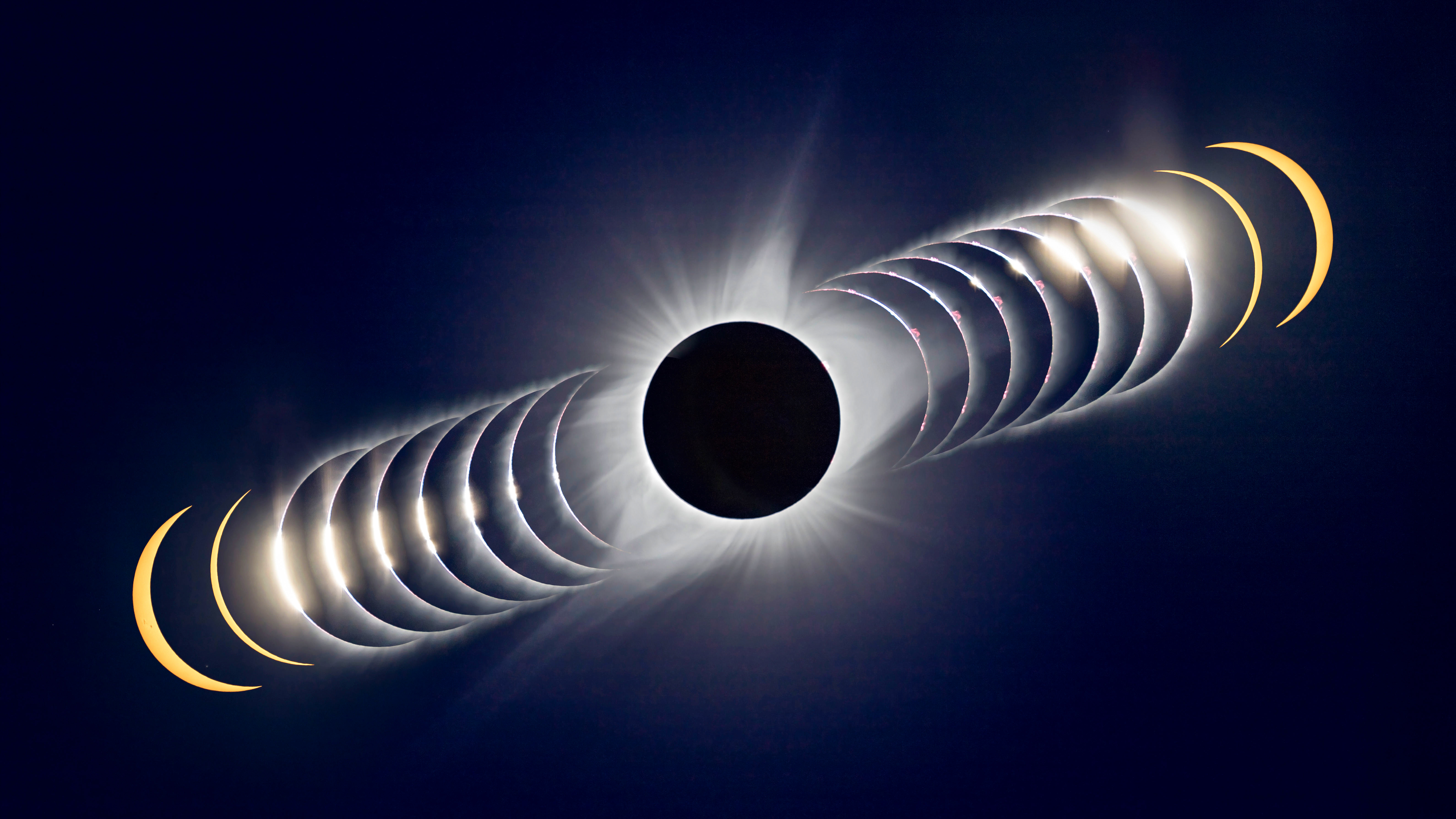 A time-sequence composite of the August 21, 2017 total solar eclipse. In this case, time runs from left to right, from the last filtered partial phases I shot, through unfiltered shots of the rapidly changing last glimmer of sunlight disappearing behind the advancing Moon at Second Contact, forming Baily&acirc;&euro;&trade;s Beads, to totality at centre. The sequence continues at right with the Sun emerging from behind the Moon in a rapid sequence at Third Contact, followed by two post-totality filtered partials to bookend the total eclipse images. The C3 limb had a beautiful array of pink prominences. The Contact 2 and 3 images were taken in rapid-fire continuous mode and so are only fractions of a second apart in real time. Most are 1/4000th second exposures. The totality image is a blend of 7 exposures, from 1/1600 second to 1/15 second to preserve detail in the corona from inner to middle corona. These were aligned, and merged into a smart object and blended with a Mean combine stack mode. The partials are 1/2500-second exposures through a Thousand Oaks metal-on-glass solar filter for the yellow colour. The placement of the frames here only roughly matches the actual position and motion of the Sun across the sky during the time around totality. Partials and C2 and C3 images layered into Photoshop and blended into the background totality image with a Lighten blend mode, and masked to reveal just the wanted bits of each arc. The site was north of Driggs, Idaho in the Teton Valley, north of the centreline. Thus the diamond rings are above the centre of the Moon's disk.