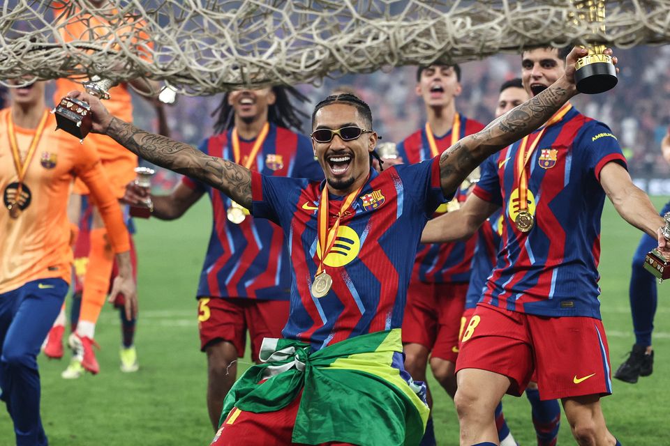 Barcelona's Raphinha celebrates with teammates after winning the Spanish Super Cup final at the King Abdullah Stadium in Jeddah. Photo: Getty