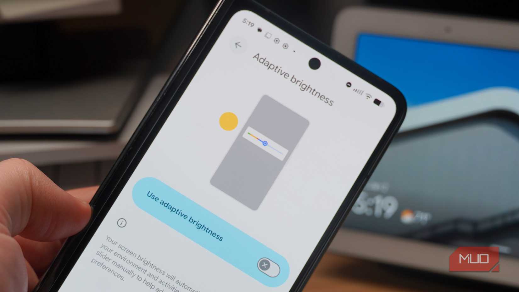 Turning off adaptive screen brightness in the Settings app on a Pixel phone.