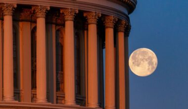 Photo of the full moon behind the pillars US Capitol Dome on February 25, 2024, in Washington, DC.