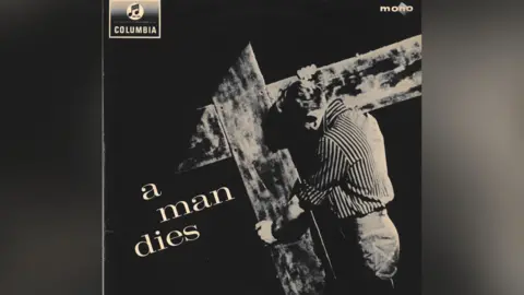 Ricky Ford The album cover for A Man Dies, showing a man in a stripy shirt carrying a cross