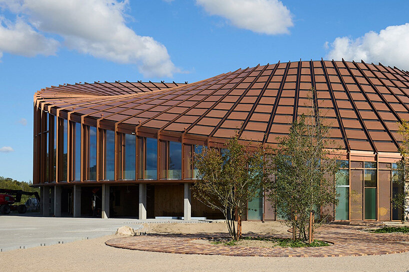 watch: ballet dancers take over BIG's circular timber building of dymak HQ in denmark