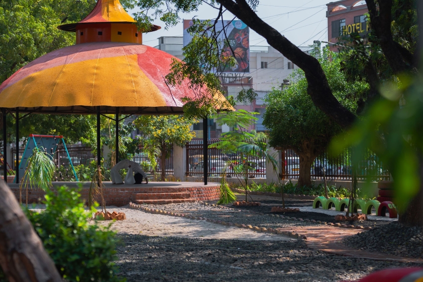 reclaimed materials sculpt textured children’s play structures in india public park