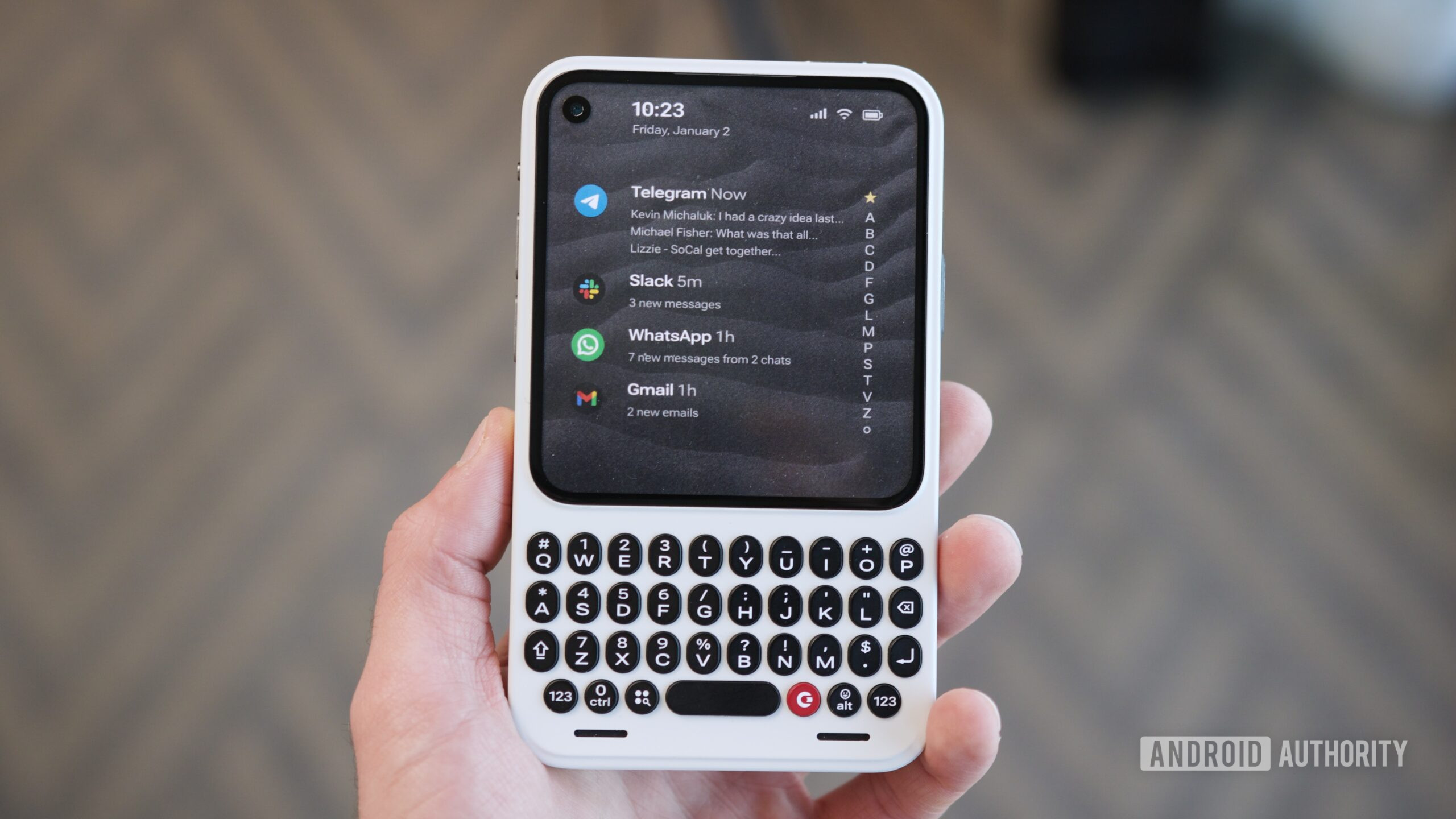 Holding the Clicks Communicator.