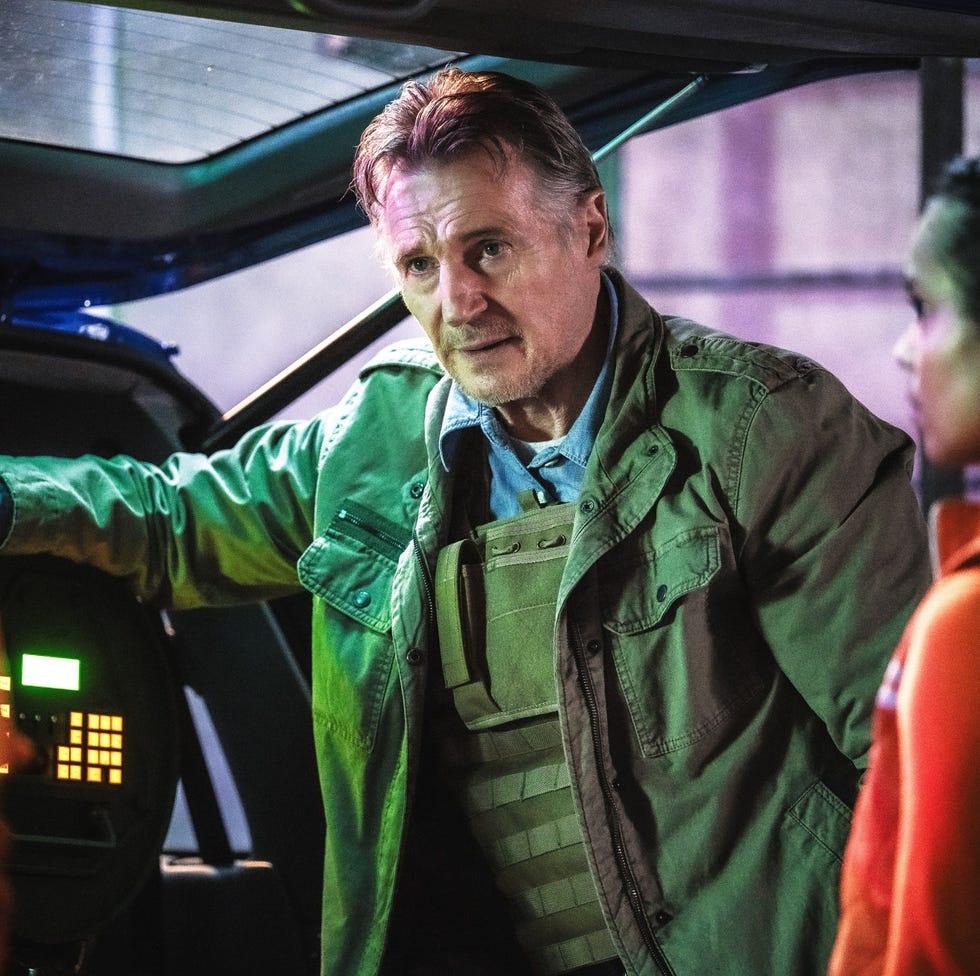 three individuals in tactical and work attire discussing near a vehicle three individuals in tactical and work attire discussing near a vehicle