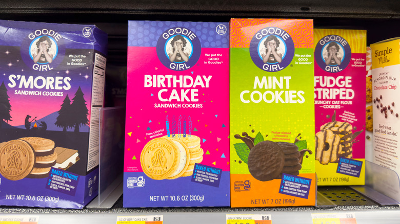Bags of Goodie Girl s'mores, birthday cake, mint, and fudge striped cookies on grocery store shelf