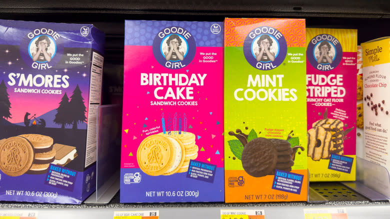Bags of Goodie Girl s'mores, birthday cake, mint, and fudge striped cookies on grocery store shelf