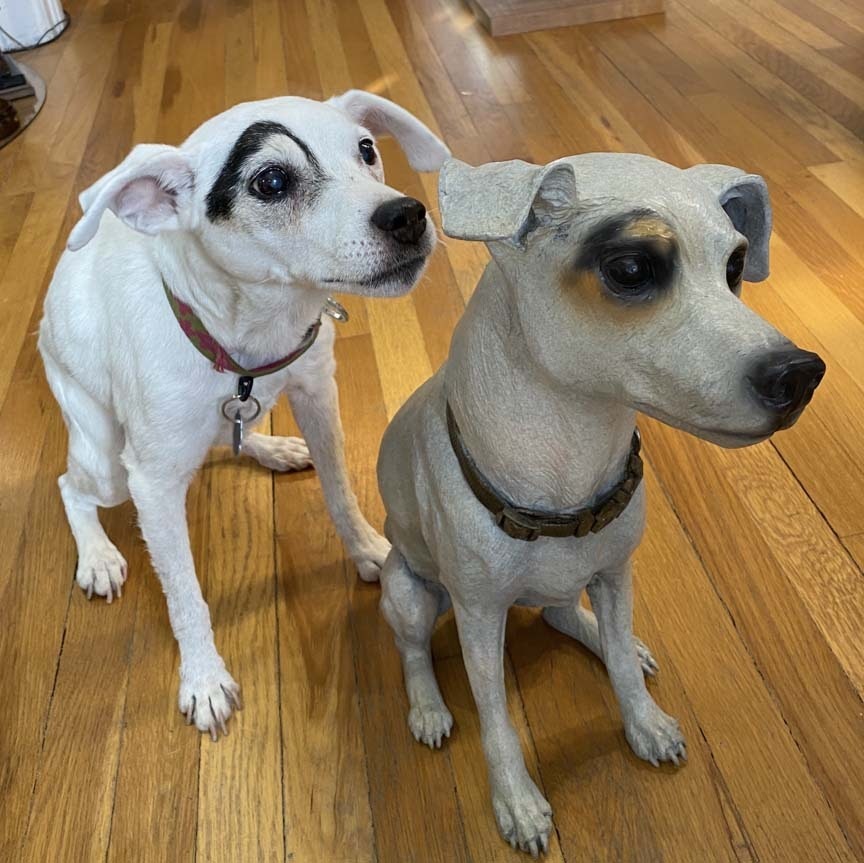 16-year-old Dot posing with her brand new bronze likeness