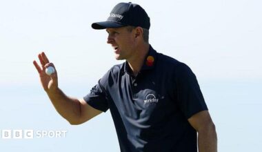 Justin Rose picks up his ball