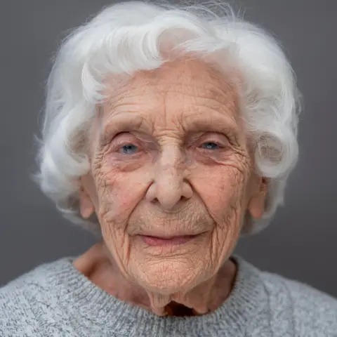 Portrait of Britain/Karsten Thormaehlen A head and shoulders portrait of Charlotte "Betty" Webb who has white hair and piercing blue eyes. she is wearing a light grey woollen jumper.