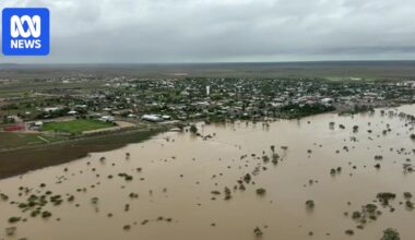 Tourists stranded, dozens of roads closed as showers continue in flooded outback Queensland