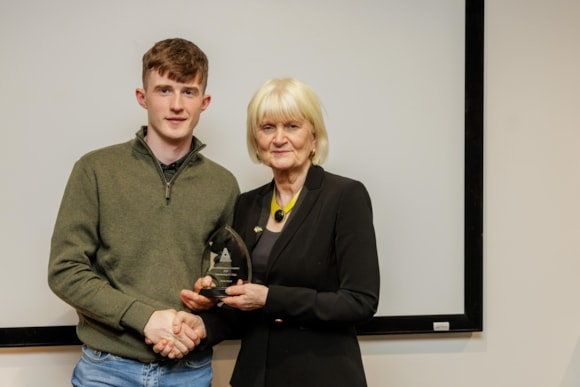 Minister of State at the Department of Further and Higher Education, Research, Innovation and Science, Marian Harkin TD, presenting the award to ATU Sligo student Aaron Hayes.