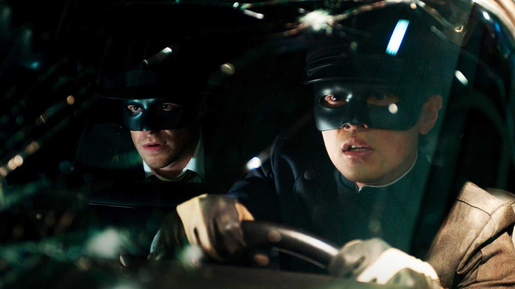 Kato (Jay Chou) takes the wheel of a tricked-out car, with the Green Hornet (Seth Rogen) riding shotgun in this nighttime image from 2011's The Green Hornet.